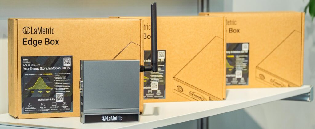LaMetric Edge Box in front of its retail boxes