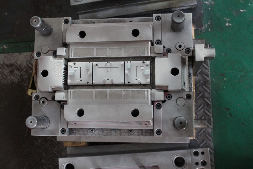 LaMetric TIME injection mold cavity with the engraved LaMetric logo
