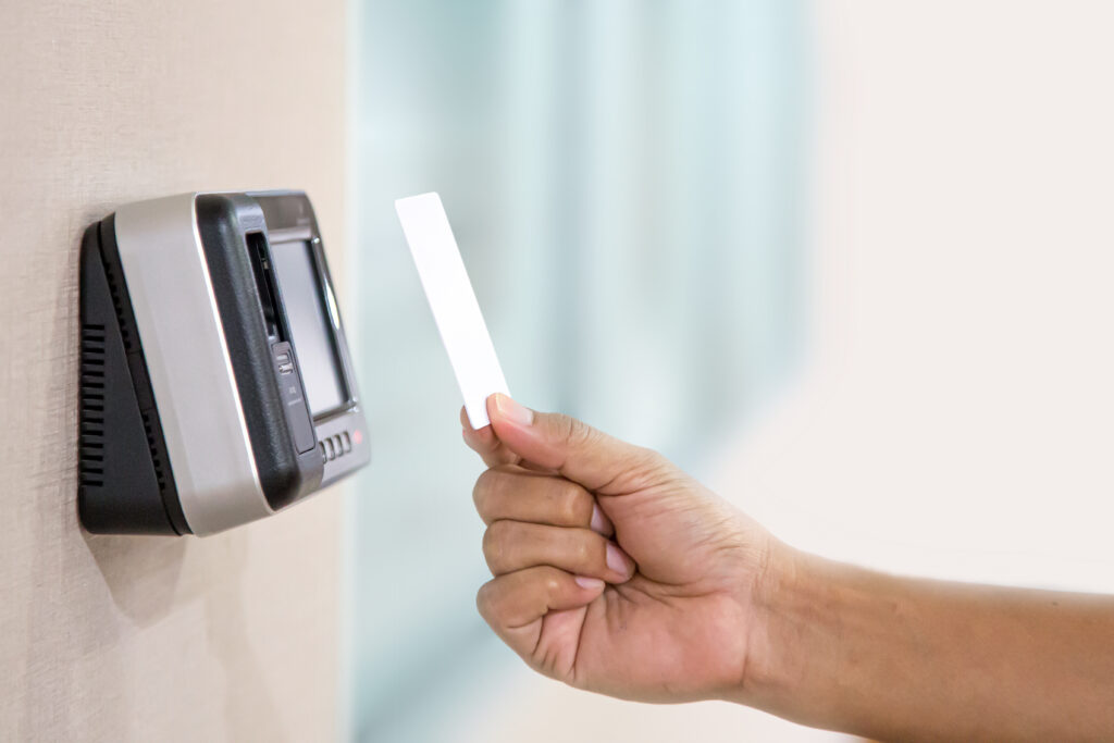 Proximity card reader door unlock Hand security man using ID