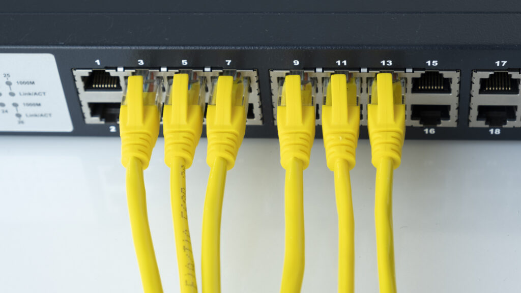 Network switch and six yellow ethernet cable Network connect