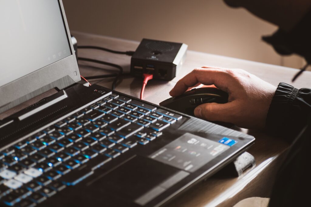 Engineer testing a connected device from a laptop