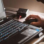 Engineer testing a connected device from a laptop