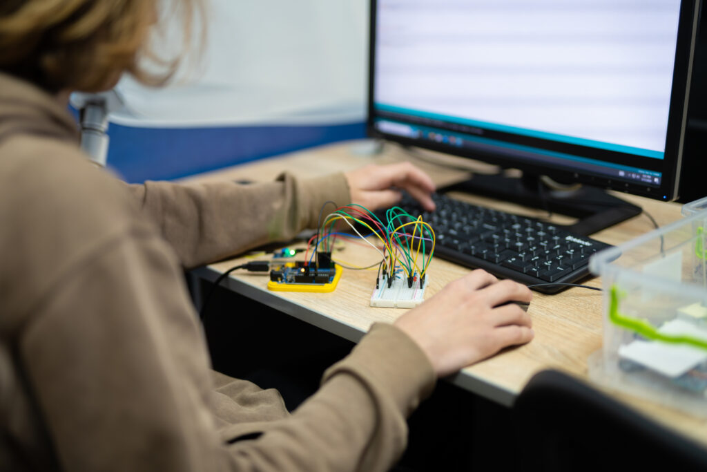 An engineer is engaged in the development and layout of elec