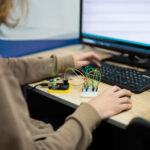 An engineer is engaged in the development and layout of elec