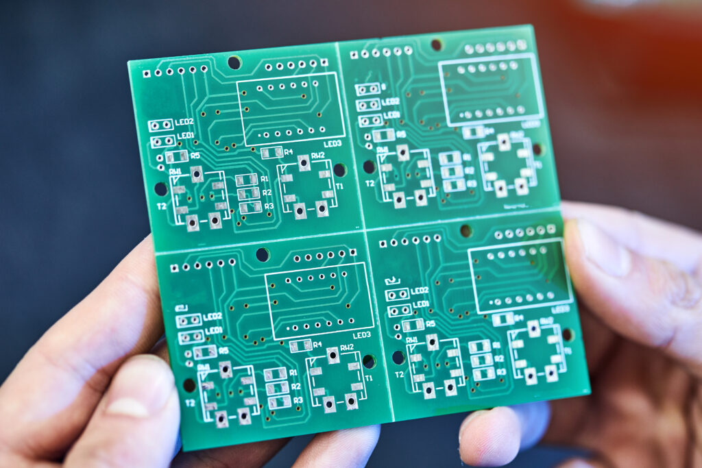 Green system board with microchips and transistors Engineer