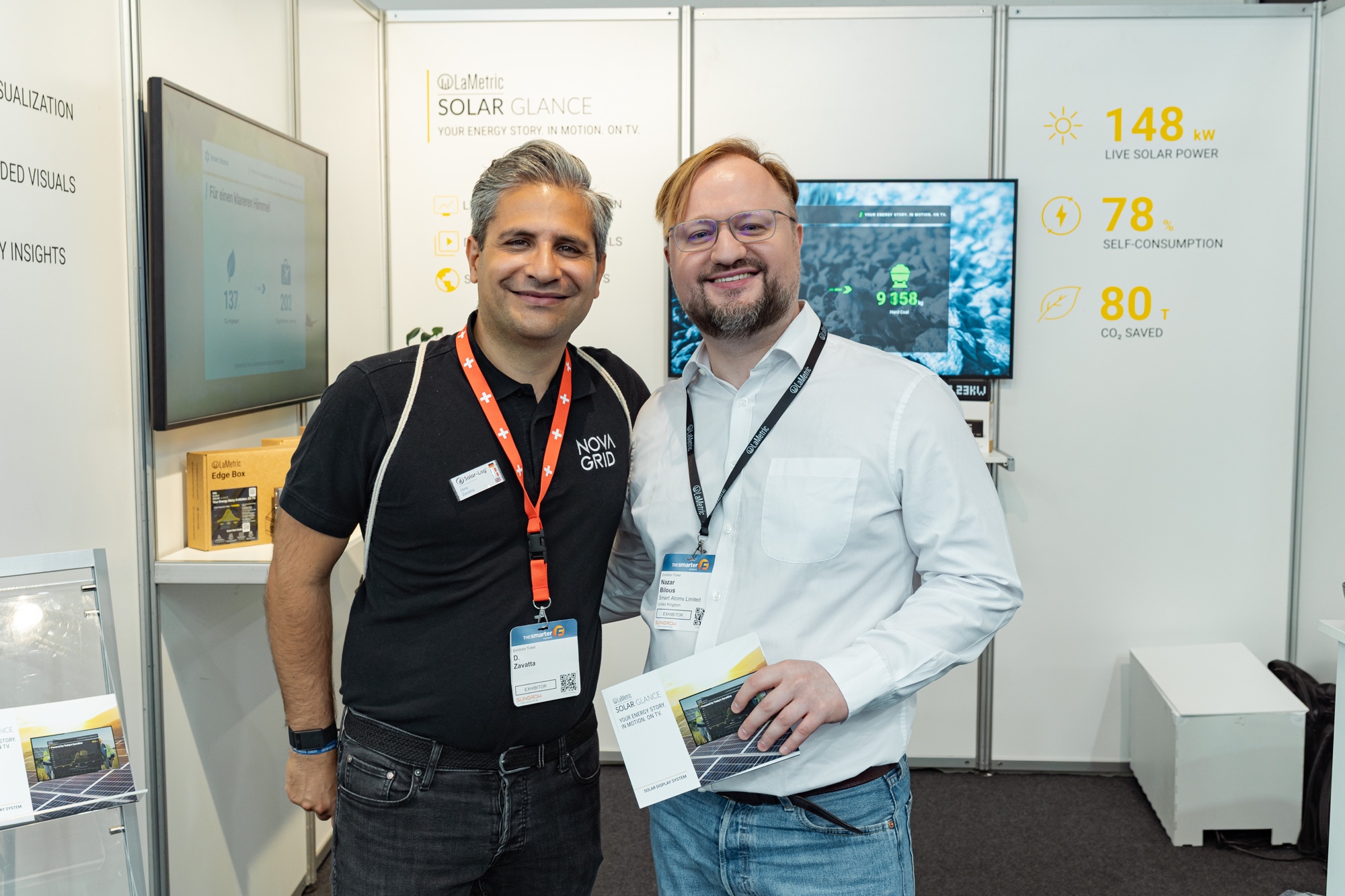 Nazar Bilous with a distribution partner at the Smart Atoms booth