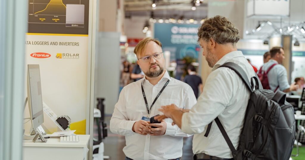 Nazar Bilous talking with a visitor at the LaMetric stand at Intersolar Europe 2026