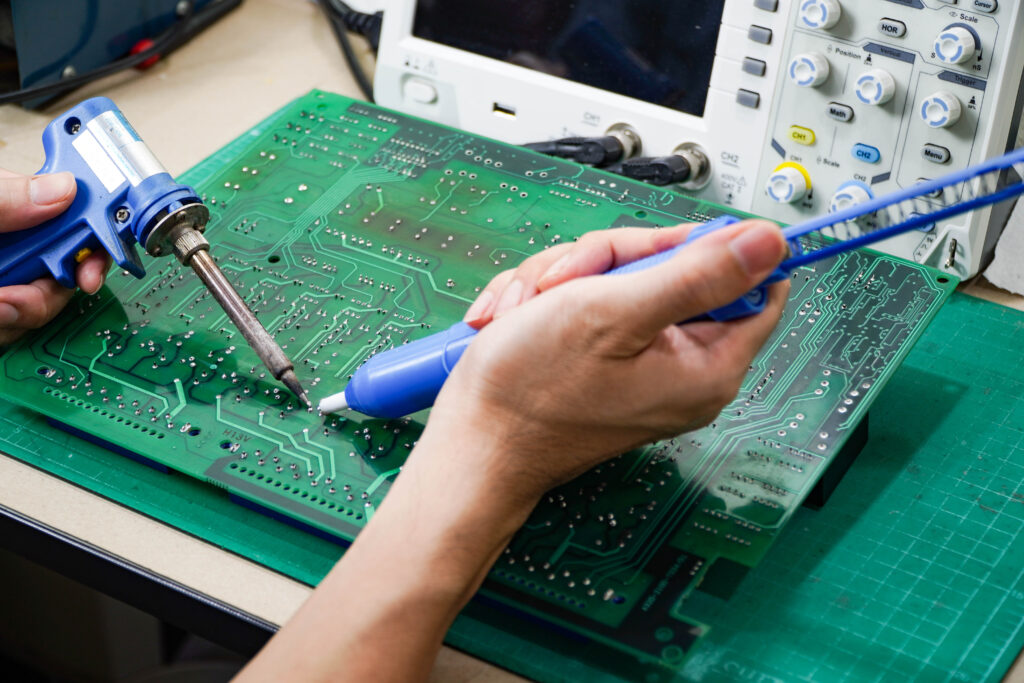 Operating engineer Repair soldering the circuit board of the