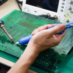 Operating engineer Repair soldering the circuit board of the