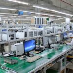 Workers Assembling Electronic Components on Factory Assembly