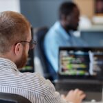 Software engineer reviewing code on a laptop